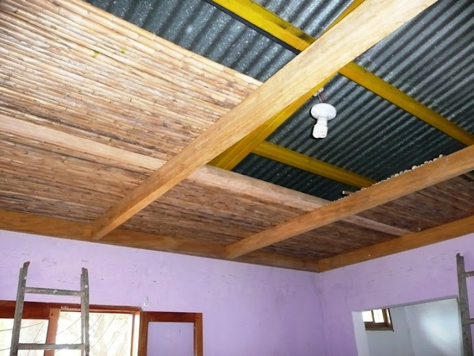 Partially installed cane ceiling in our house; later, it'll be sealed.