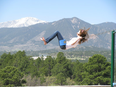 Swinging with Pikes Peak in background