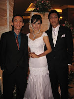 Jason Geh flanked by bridal couple