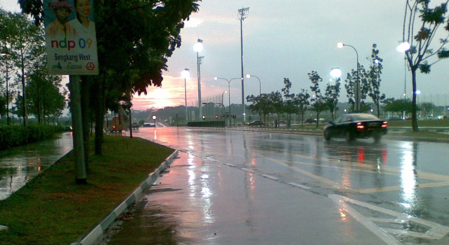 Reflection on the road after rain Married To Singaporean