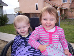 Lily and Aubrey playing in Grandma's wheelchair