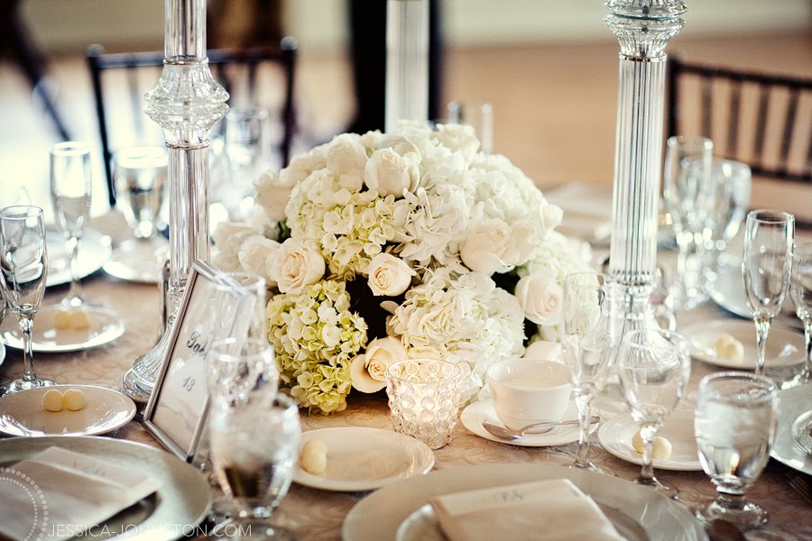 white wedding floral arrangements. Floral arrangements are by