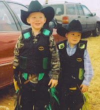 Bailey and Garrett getting ready to ride sheep.