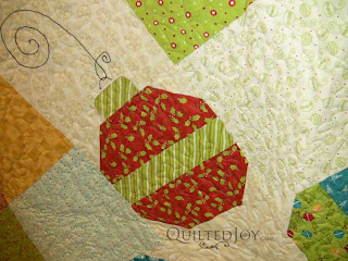 Christmas quilt with Moda Fabrics, quilted by Angela Huffman