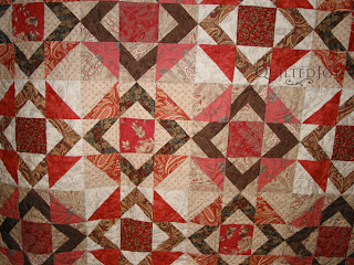 Square in a Square in reds with the Featheration Pantograph. Quilting by Angela Huffman - QuiltedJoy.com