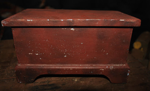 A doll-size smoke-painted antique chest