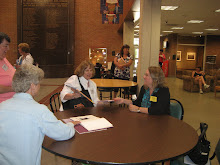 Stacy Schuett talking with a fan.