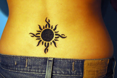 Tribal Sun Tattoo in the Lower Back
