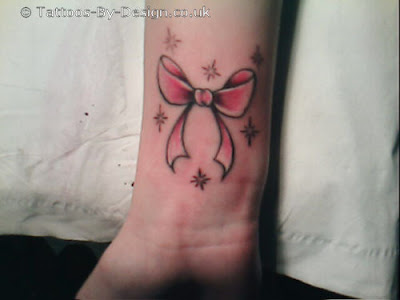 bow tattoo designs tattooed on girls wrist tattoos
