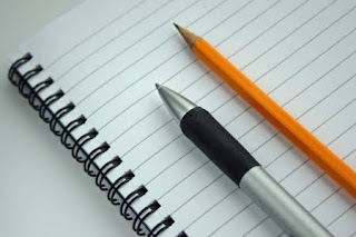 photo of pen and pencil on paper