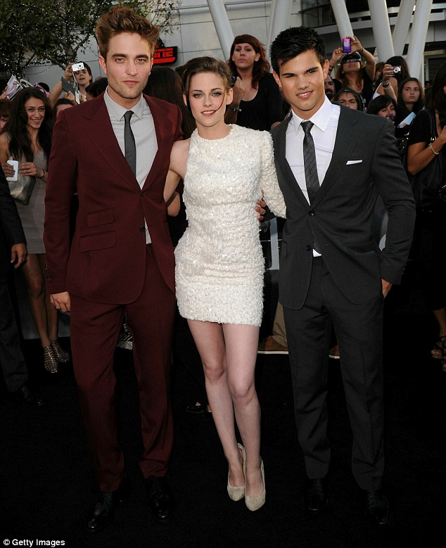 The stars Robert Pattinson Kristen Stewart and Taylor Lautner arrive at 