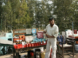 Selling oil outside Dargah