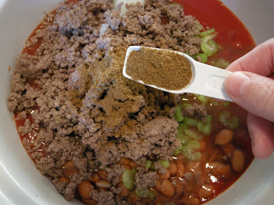 Add cumin and ground beef to slow cooker.