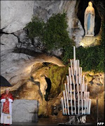 POPE BEFORE THE GROTTO