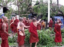 [monks_clear_up_roads_damaged_by_cyclone_in_Yangon,_Sunday,_May_4,_2008-ap-210.jpg]