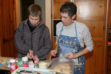 Tanner helping Grandma Janet decorate cookies