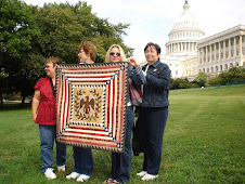 Trip Organizers Display Quilt for President