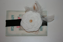 White flower and feathers with vintage lace