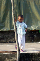 kid in fishing village