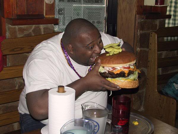 fat boy eating food. fat people eating mcdonalds. fat boy eating food.