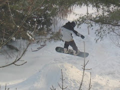 Kids snowboarding in my the back yard