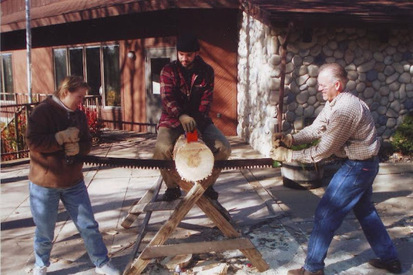 Jay & Linda using the crosscut saw at Camp Forest Springs (11-07)