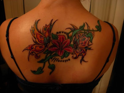 rose tattoos for girls on hip. A butterfly tattoo also