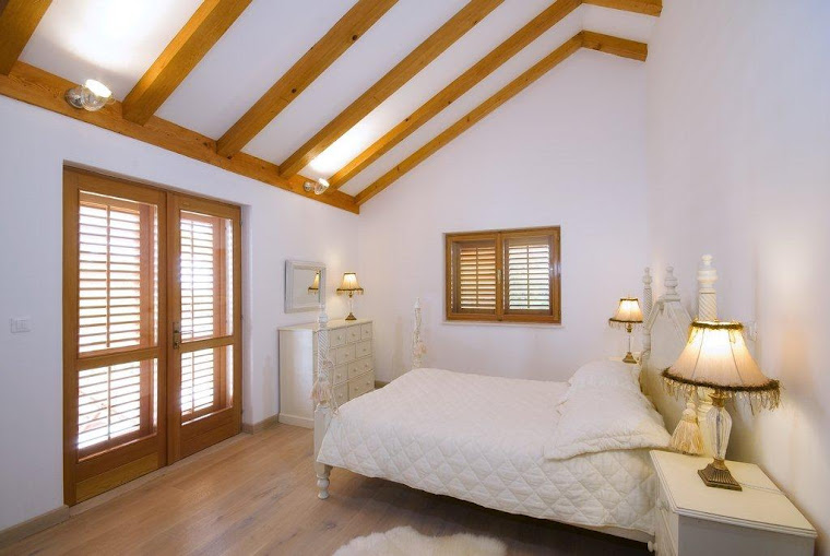 Penthouse bedroom with king sized bed and black leather ensuite