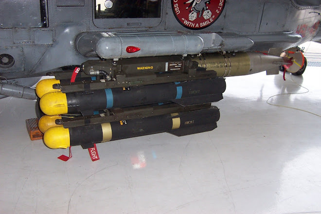 the hell fire missiles there are 4 and the torpedo in the background of it