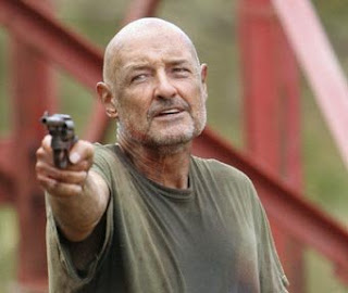 Now when you get to be my age, young man, you start having all kinds of things go wrong with your body. Now I suggest you sit down and listen up. John Locke Terry O'Quinn gun pointing