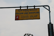traffic sign no one follows in kanada (language of Bangalore), english, and hindi