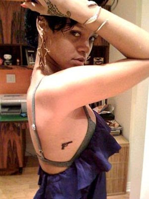 Rihanna did not show any reservation about getting new gun tattoo