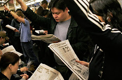 It is very common to see people reading books or newspapers while commuting to school or work.