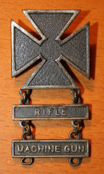 Marksman Badge with rifle and machine gun qualification bars.