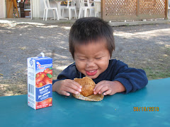 Alexandre having fun eating his apple muffin