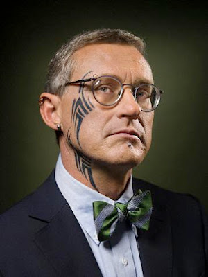 Tribal Tattoo Body Art A glasses man with cool tribal tattoo from face to 
