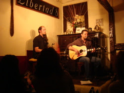 Note the drummer with the comedy beard
