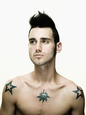 Young man with two black transparent star tattoo on his shoulder and skull
