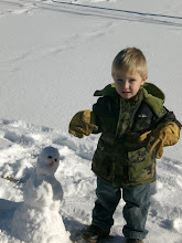 Kaden with baby snowman