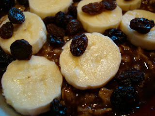 Close up of oatmeal with bananas and raisins  