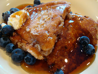 Vegan Pancakes with butter, syrup and blueberries