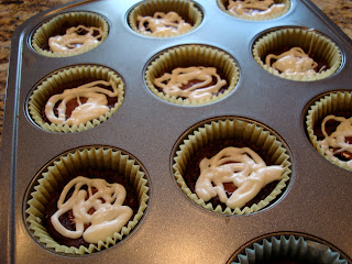 Drizzled PB Cup Brownie Cupcakes in muffin tin