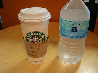 Starbucks cup and bottle of water