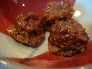 Three Vegan Almost Raw Girl Scout Samoas Cookies on red and white plate