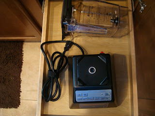 Un assembled blender in kitchen drawer for easy storage