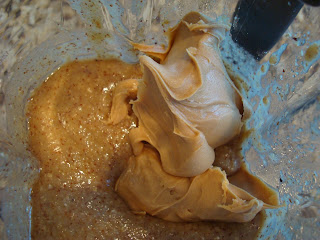 Peanut butter being added to blended ingredients