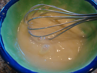 Sauce ingredients being whisked in bowl