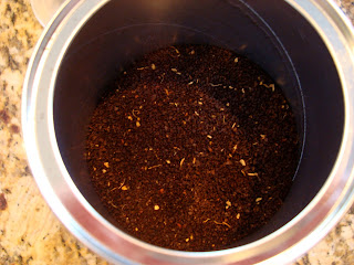 Inside coffee canister showing ground coffee
