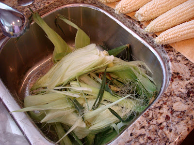 Removing silk and outside of corn