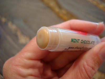 Hand holding a Mint Chocolate Lip Balm